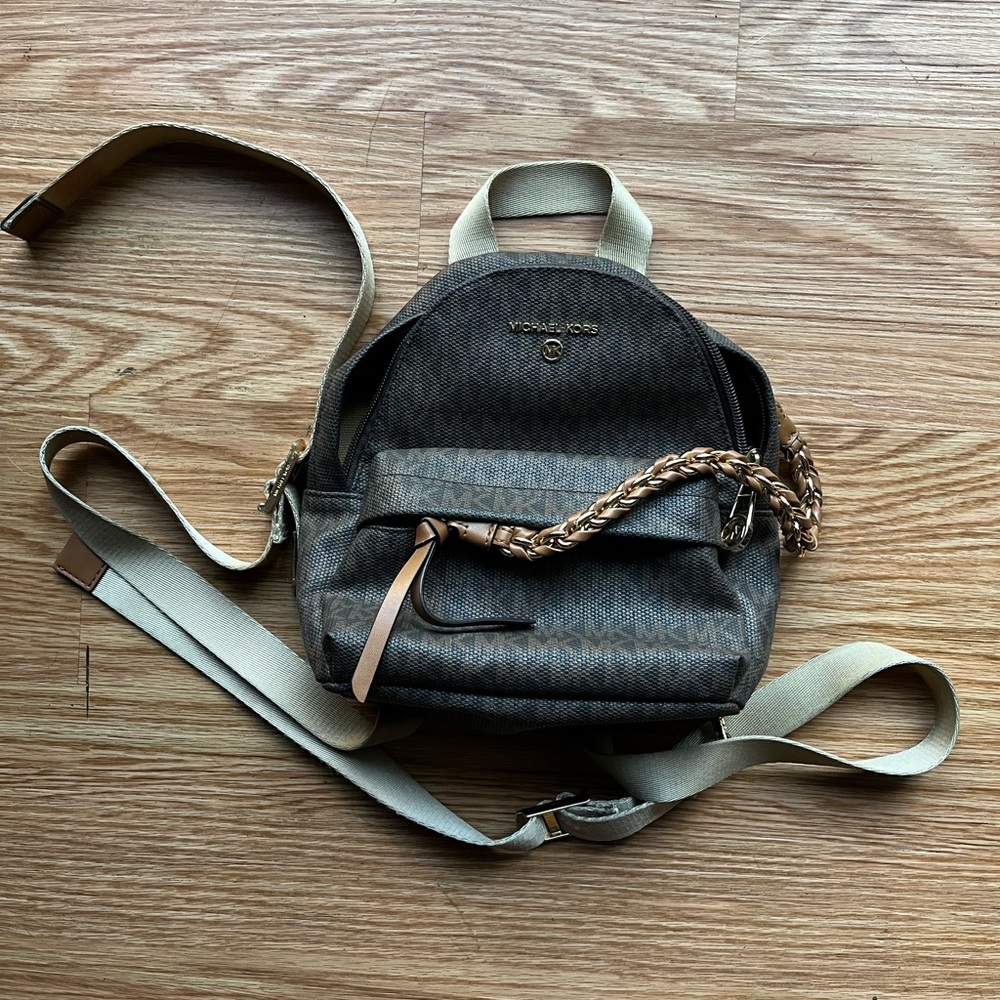 Selling this used Michael Kors mini backpack purse!